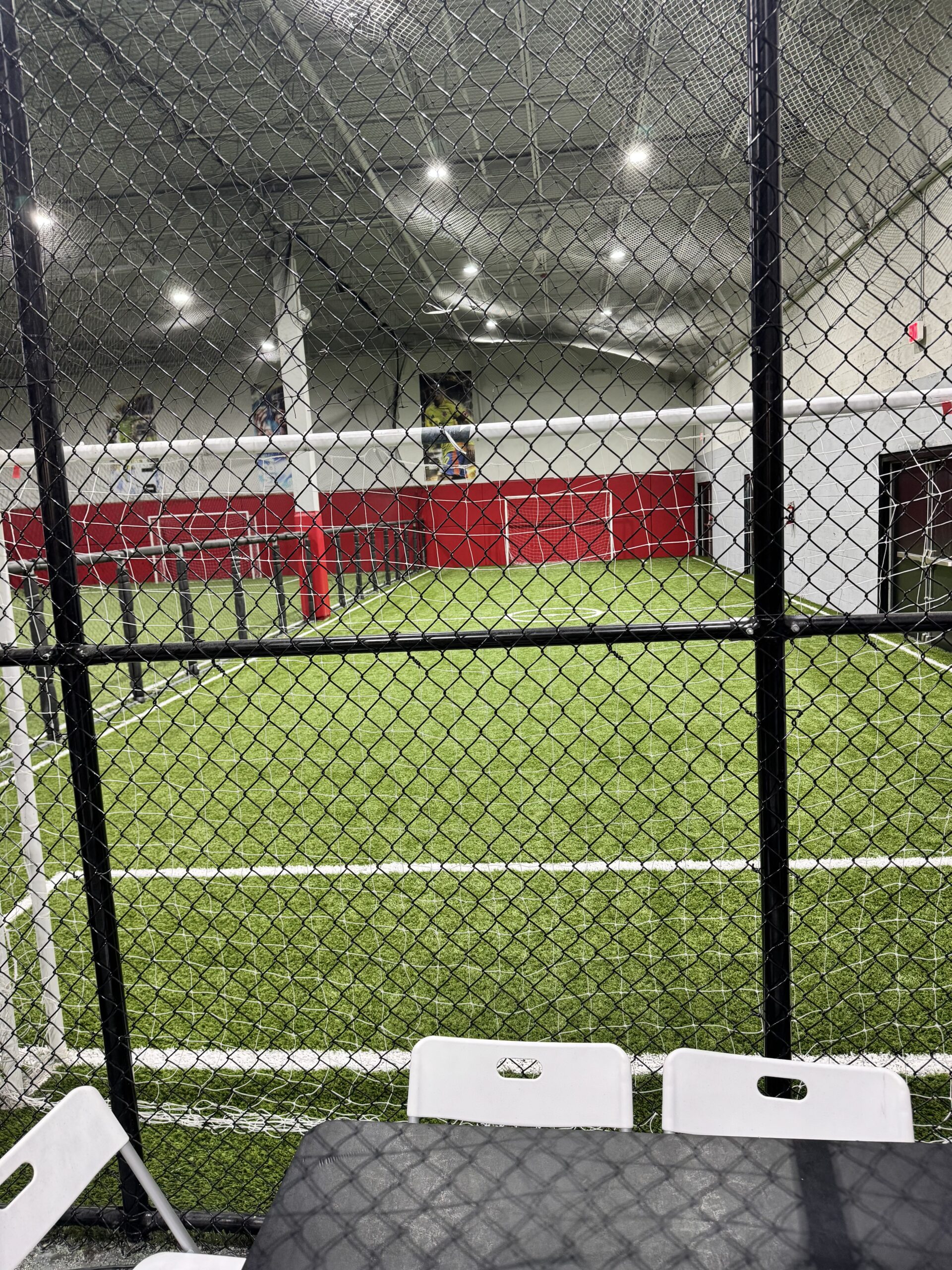 Small sided indoor soccer field behind safety netting in Lake Worth, Florida