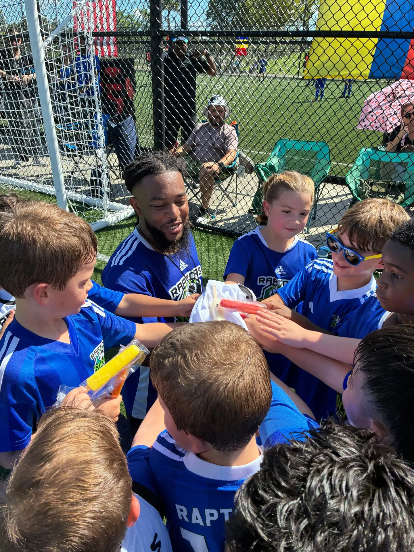 Team huddle at Piccolo Park in Cooper City